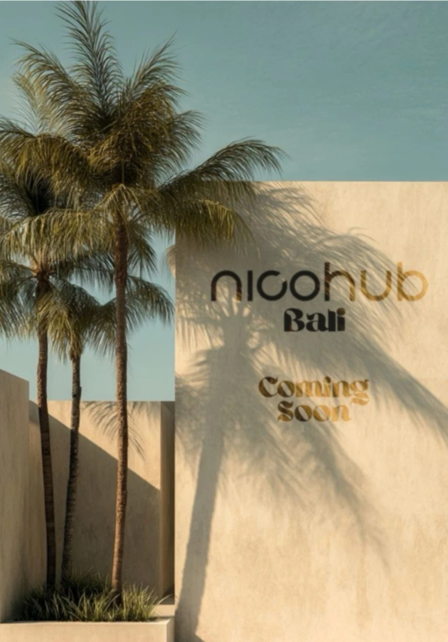 Front view of Nicohub Bali Coming Soon poster – tropical palm shadows on modern beige wall